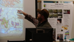 Earth Systems Science student pointing to something on a map.